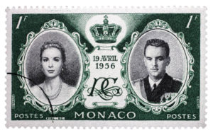 MONACO - CIRCA 1956: Green color stamp printed in Monaco with portrait of Grace Kelly and Prince Rainier to commemorate their marriage, circa 1956.